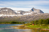 Red house on the shore