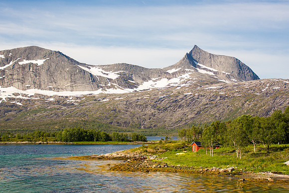 Red house on the shore